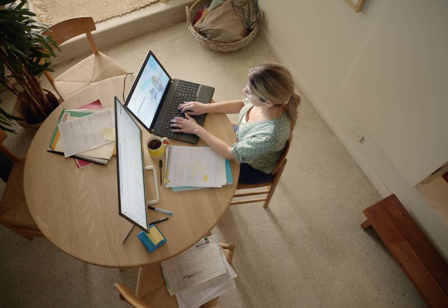 Photo of a women working at home.